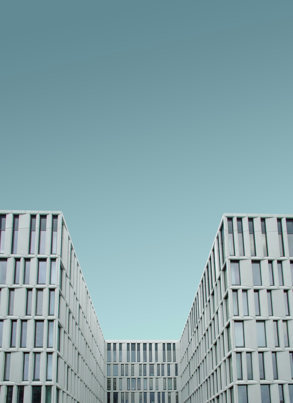 man's eye view of white quadrangle building