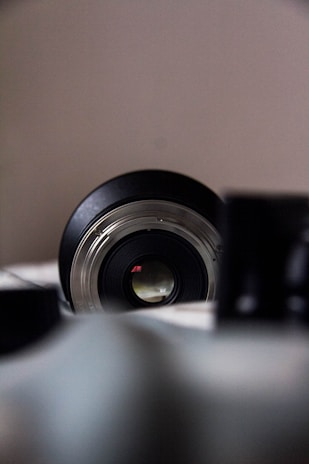 Close-up of a camera lens focusing on a vibrant subject.