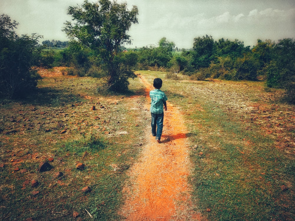 child walking on pathway