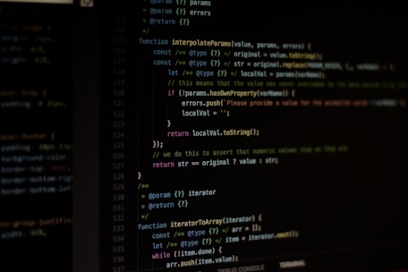 Computer screen displaying lines of code written in a dark-themed code editor. The code features syntax highlighting with text in various colors for different programming elements.