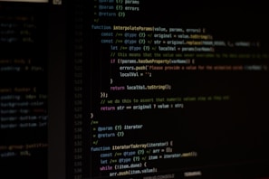 Computer screen displaying lines of code written in a dark-themed code editor. The code features syntax highlighting with text in various colors for different programming elements.