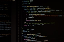 Computer screen displaying lines of code written in a dark-themed code editor. The code features syntax highlighting with text in various colors for different programming elements.