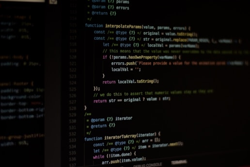 A computer screen displaying Python code with a student coding.