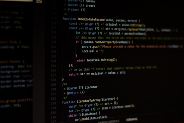 Computer screen displaying lines of code written in a dark-themed code editor. The code features syntax highlighting with text in various colors for different programming elements.