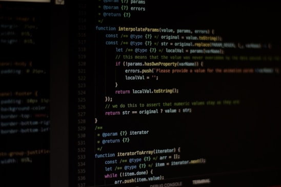 Computer screen displaying lines of code written in a dark-themed code editor. The code features syntax highlighting with text in various colors for different programming elements.