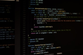 Computer screen displaying lines of code written in a dark-themed code editor. The code features syntax highlighting with text in various colors for different programming elements.