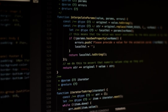 Computer screen displaying lines of code written in a dark-themed code editor. The code features syntax highlighting with text in various colors for different programming elements.