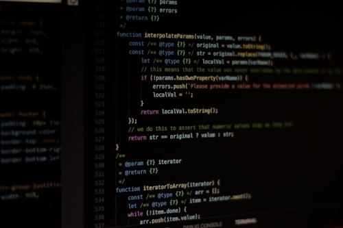 Computer screen displaying lines of code written in a dark-themed code editor. The code features syntax highlighting with text in various colors for different programming elements.