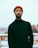 man wearing black sweater and red knitted cap