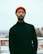 man wearing black sweater and red knitted cap