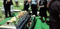 group of people attending burial