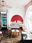 A vibrant café interior with colorful kids theme wallpapers brightening the walls.