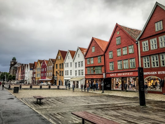 people standing near concrete houses in Bryggen Norway
