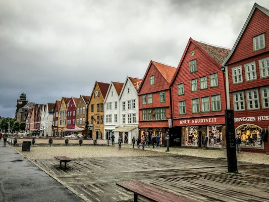 People standing near concrete houses — Bergen, Norway