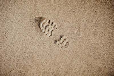 selective focus photography of foot print