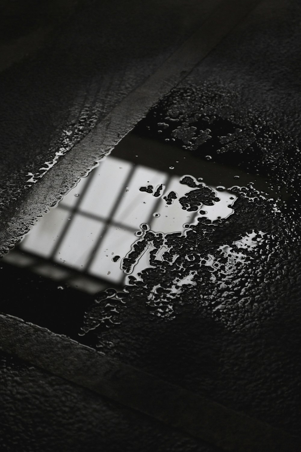 water drops on gray flooring