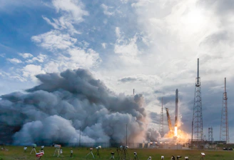 An aerial view of a launch site with musical notes in the background.