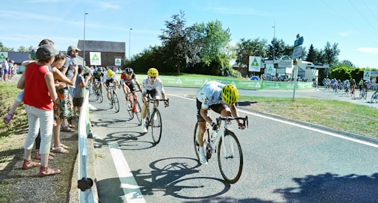 men on road bikes racing on street in La Primaube France