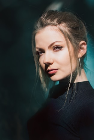 woman standing near blue wall
