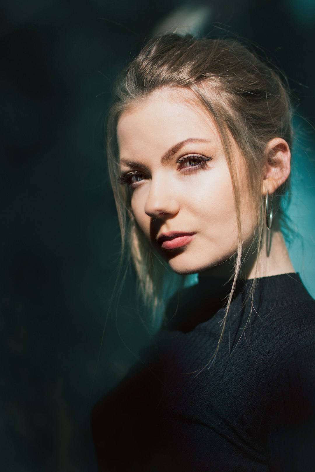 woman standing near blue wall