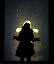 Soft glowing card featuring a subtle particle silhouette representing perception.