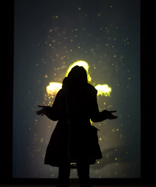 A sleek portrait of Shaik Mohammed surrounded by floating neural particles and glowing shapes.