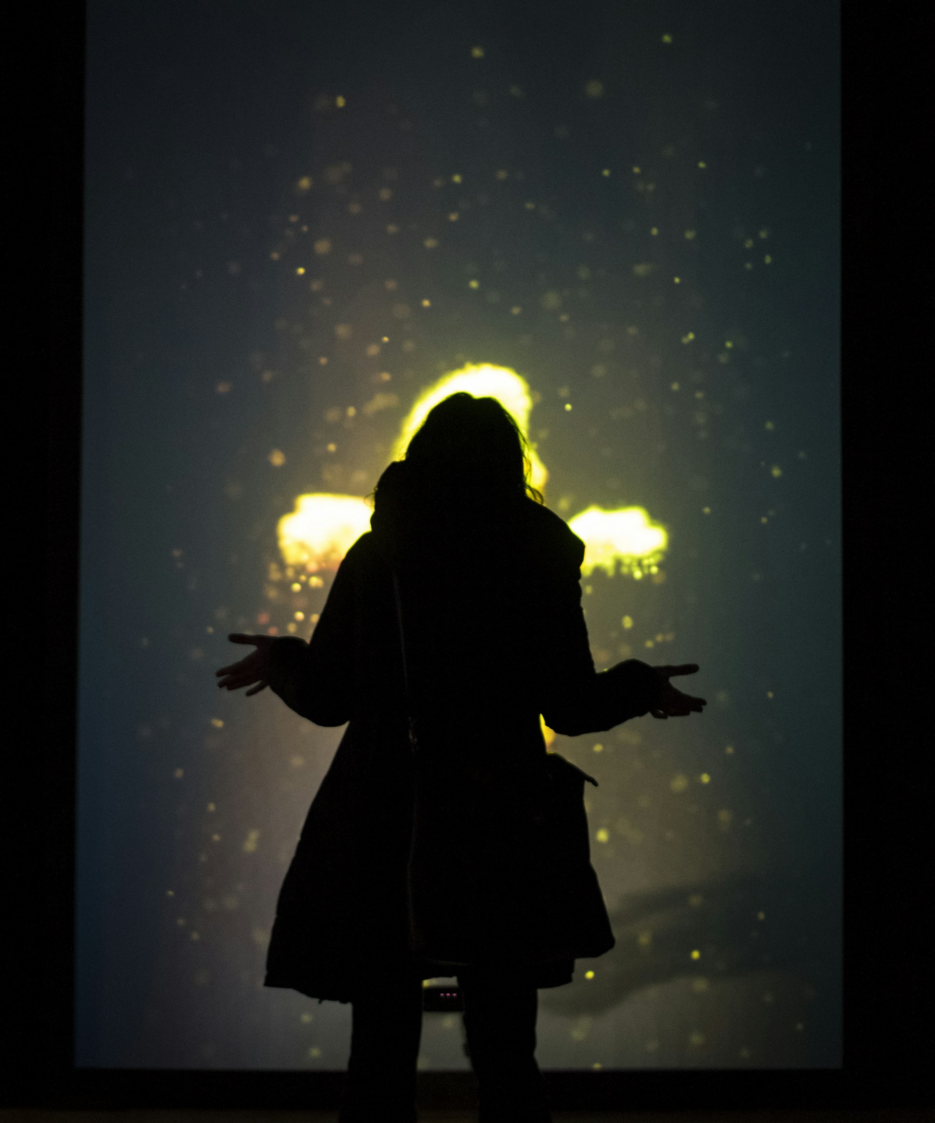 woman wearing yellow long-sleeved dress under white clouds and blue sky during daytime