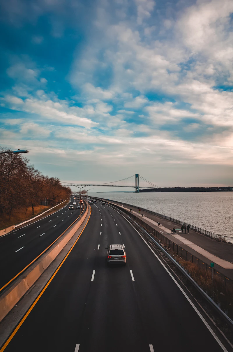 Car on the road near the water