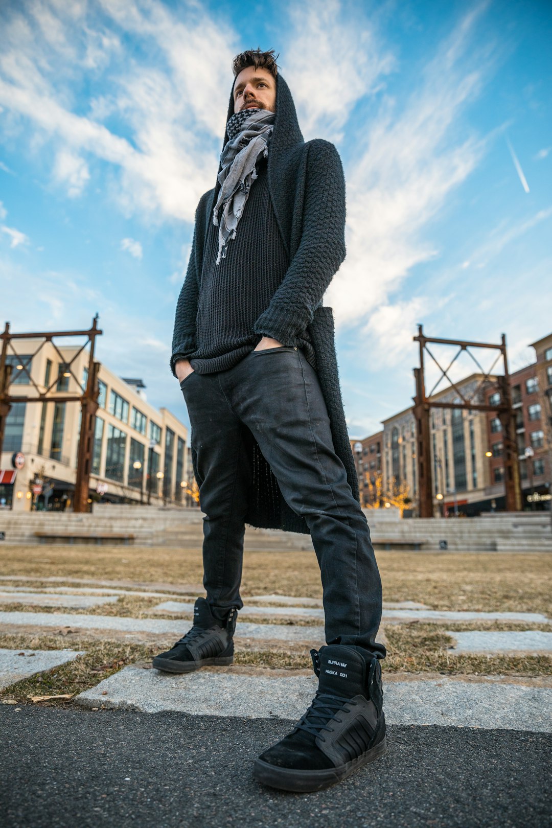 shallow focus photography of man wearing black knitted coat