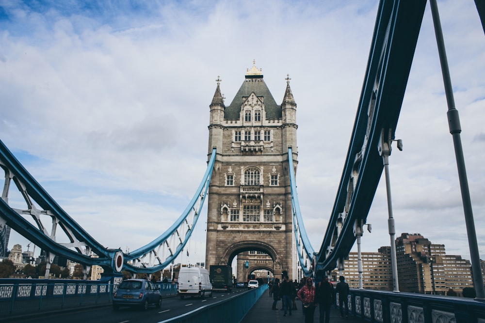 people walking on bridge during daytime