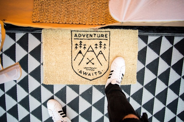 Close-up of a vibrant custom company doormat with the Montebra logo at an office entrance