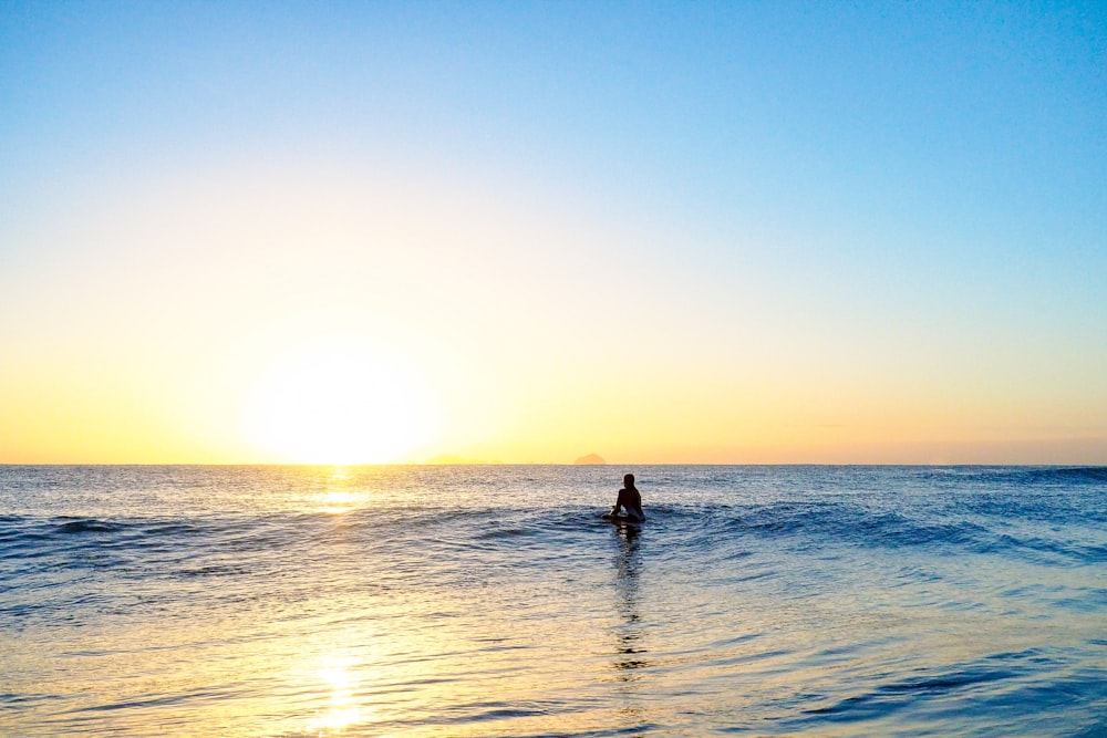 silhouette photography of person on sea