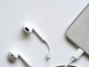 Minimalist product setup featuring sleek headphones on a clean white background.