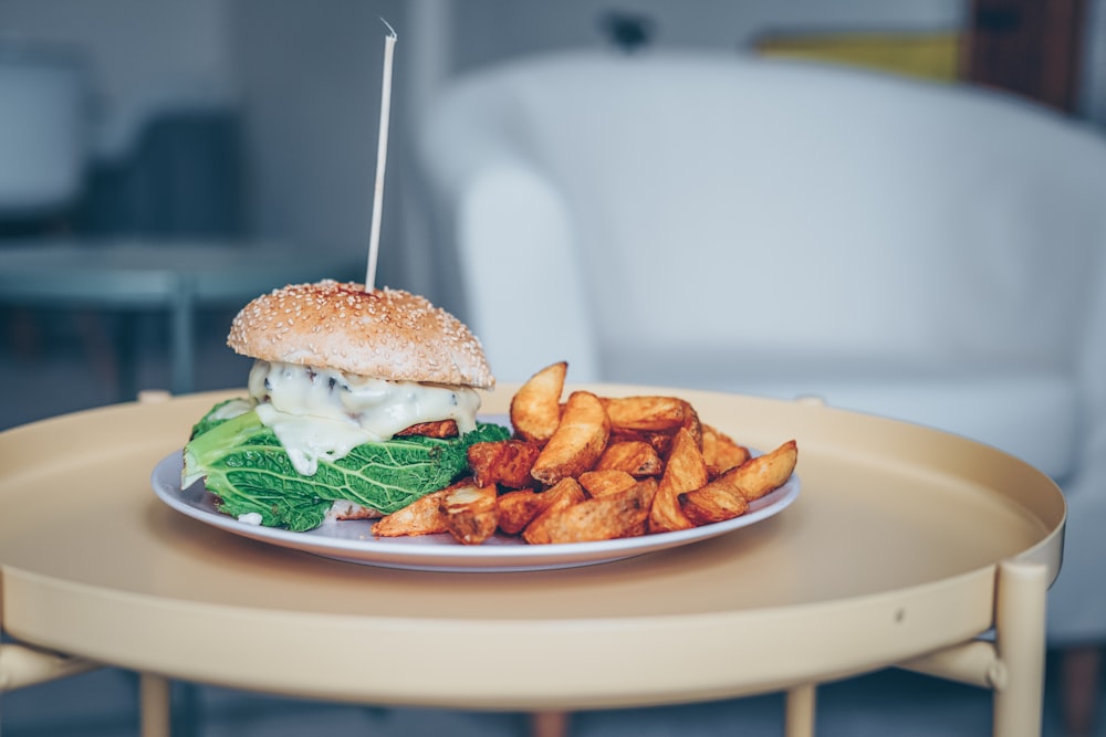 burger and fries on plate