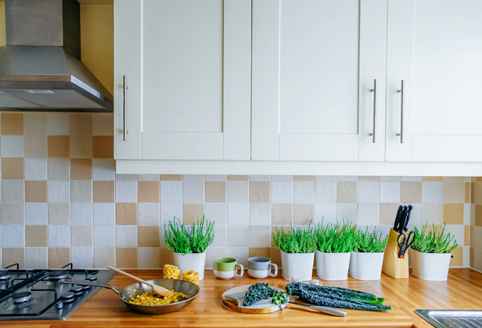 Chopping fresh herbs and vegetables on a kitchen board.