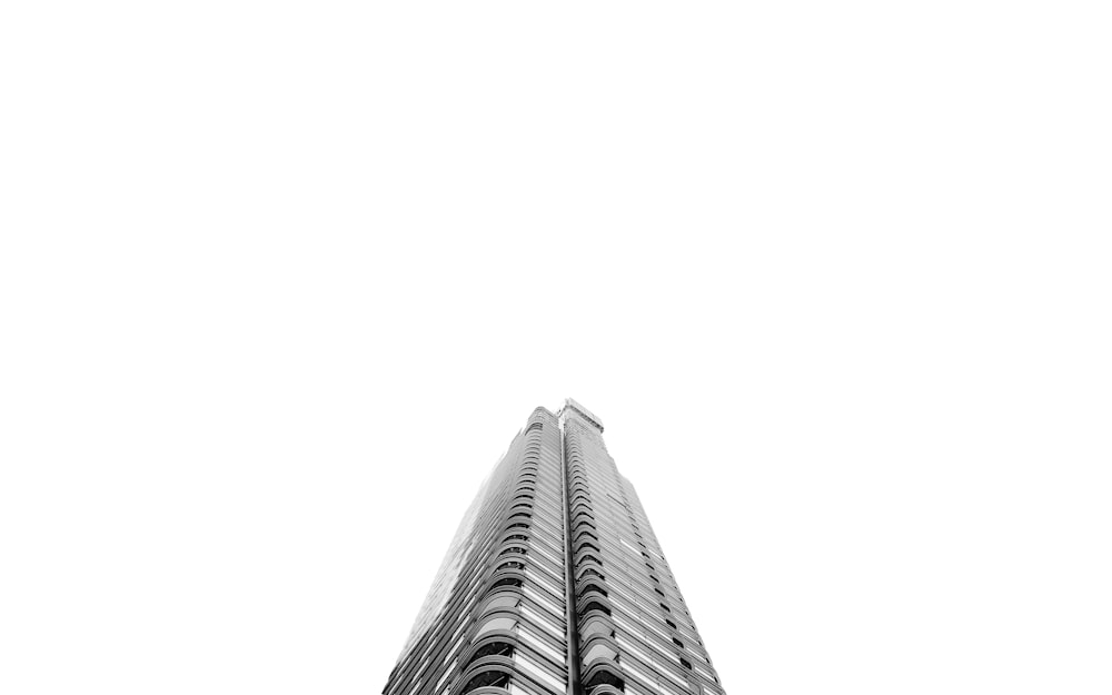 low-angle photography of grey high-rise building