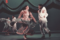 A group of dancers performing in traditional tribal attire.