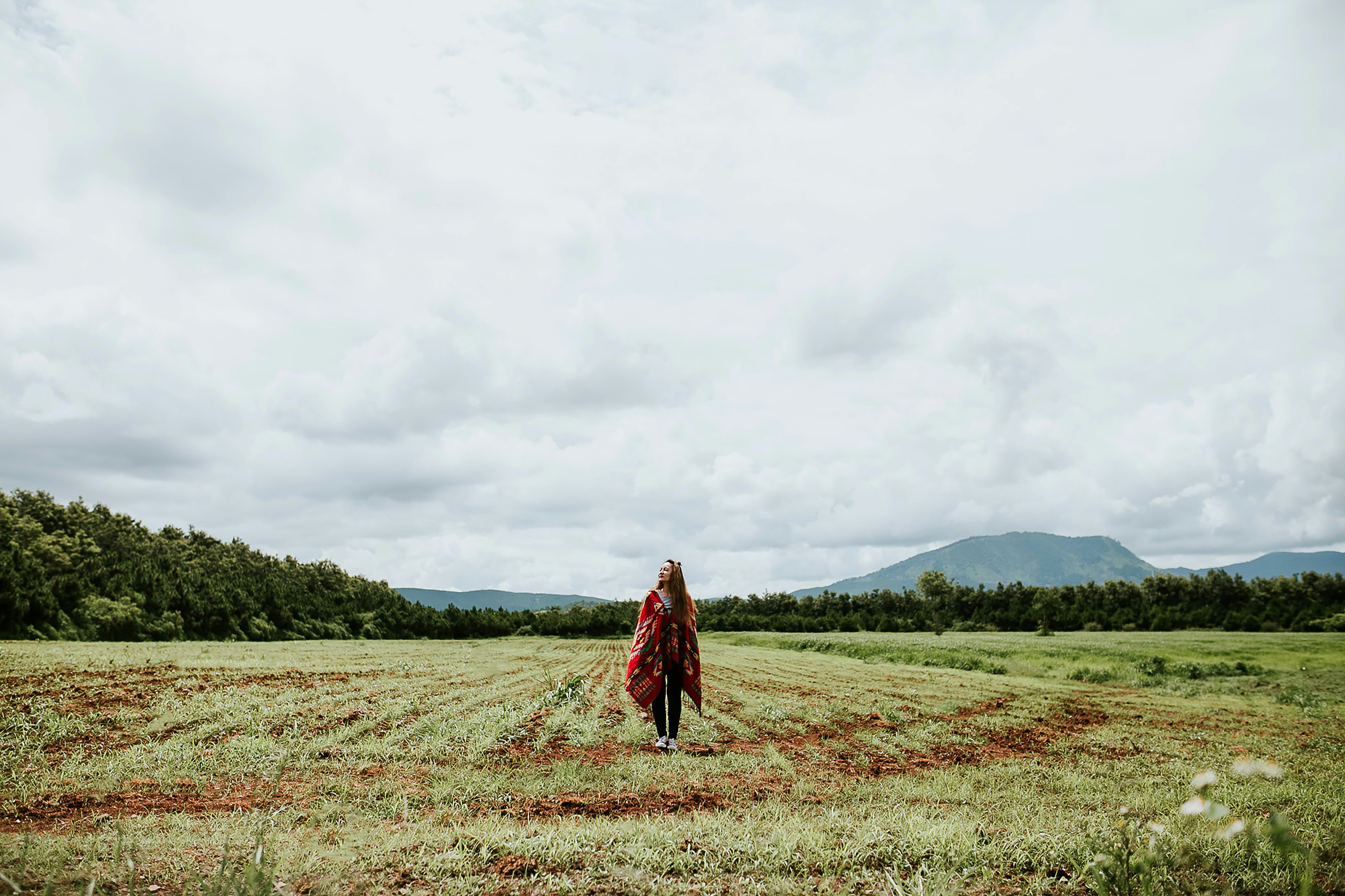 woman standing on green field