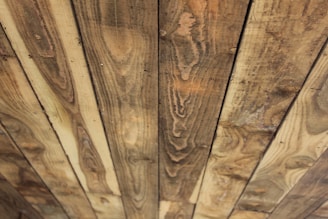 Close-up of wooden planks showing rich natural wood grain and color variations.