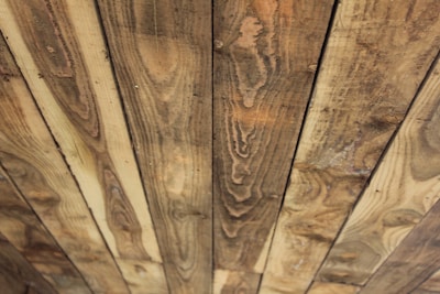 Close-up of wooden planks showing rich natural wood grain and color variations.