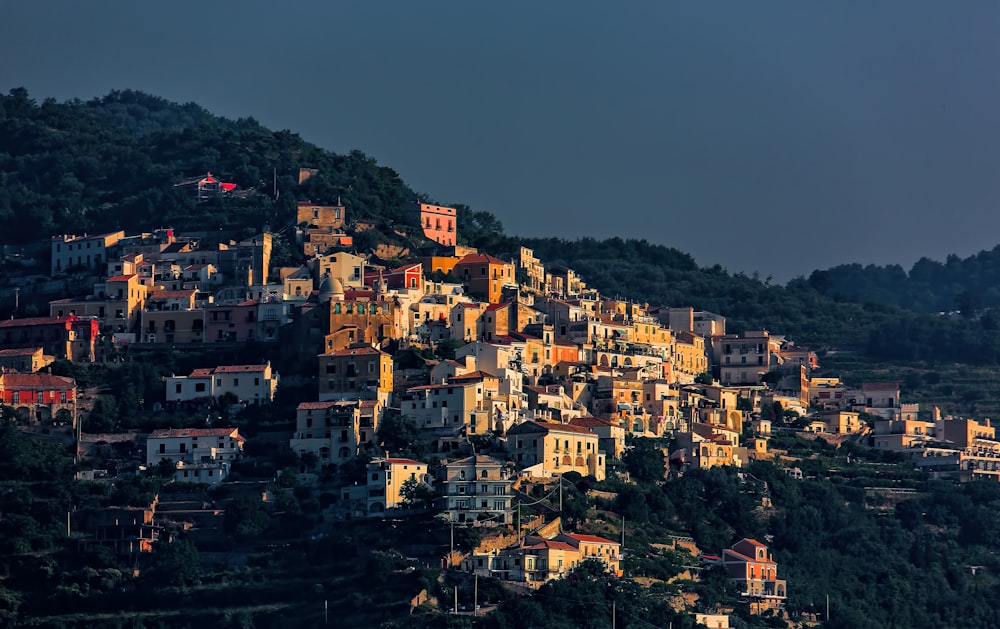 low-angle photography of town on mountain
