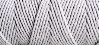 Close-up view of tightly wound, light gray yarn with visible texture and patterns formed by the twisted strands.