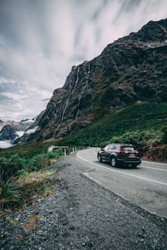 car on road near mountain