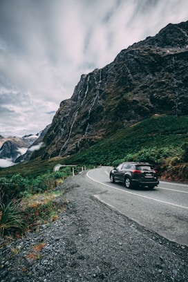 car on road near mountain