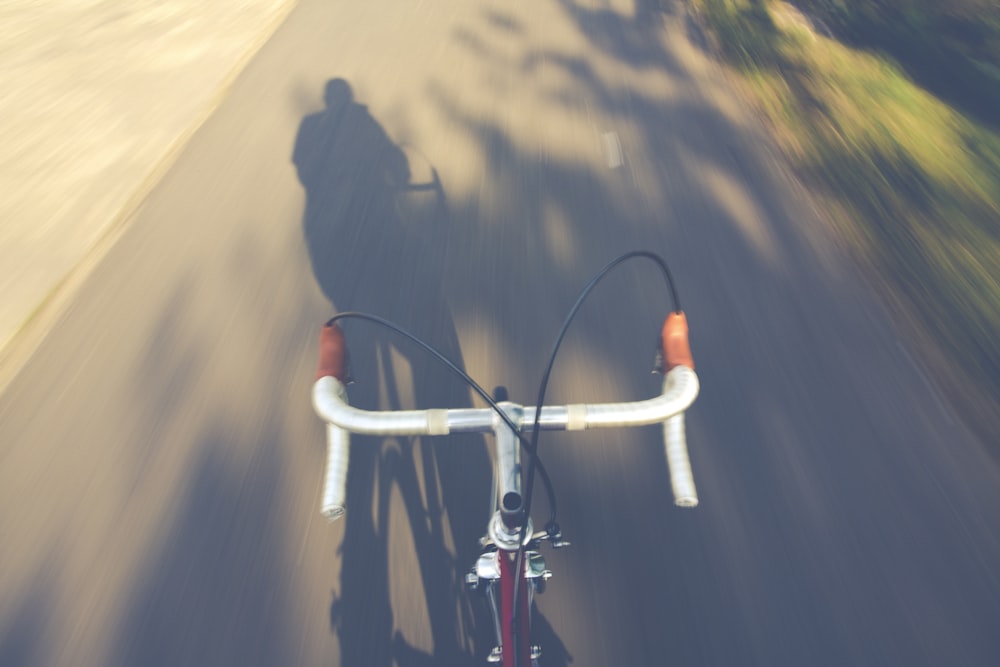 white road bike on road