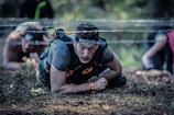 Athletes navigating a challenging outdoor obstacle course during a sporting event.