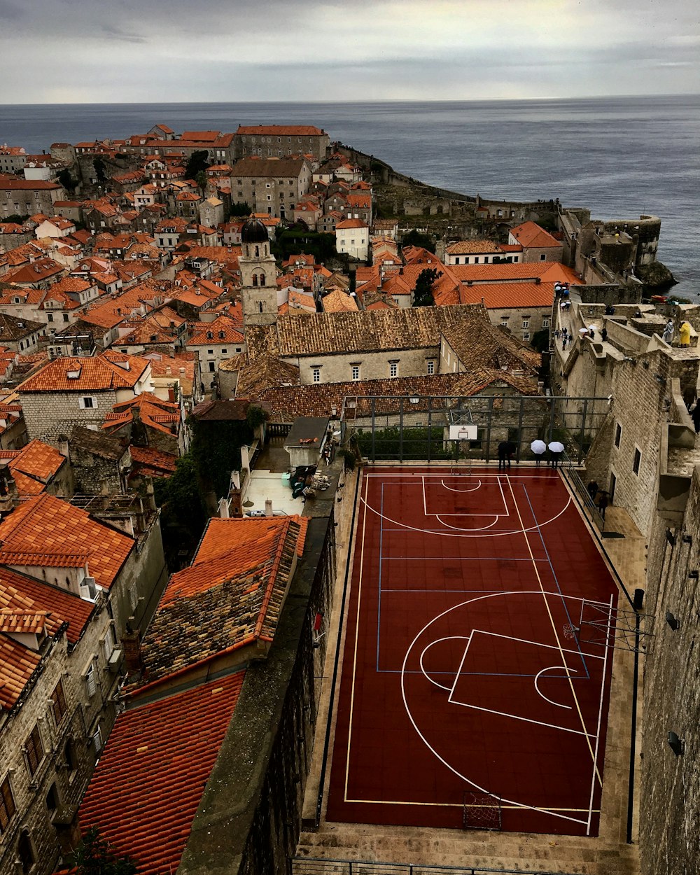 aerial photography of basketball court near town