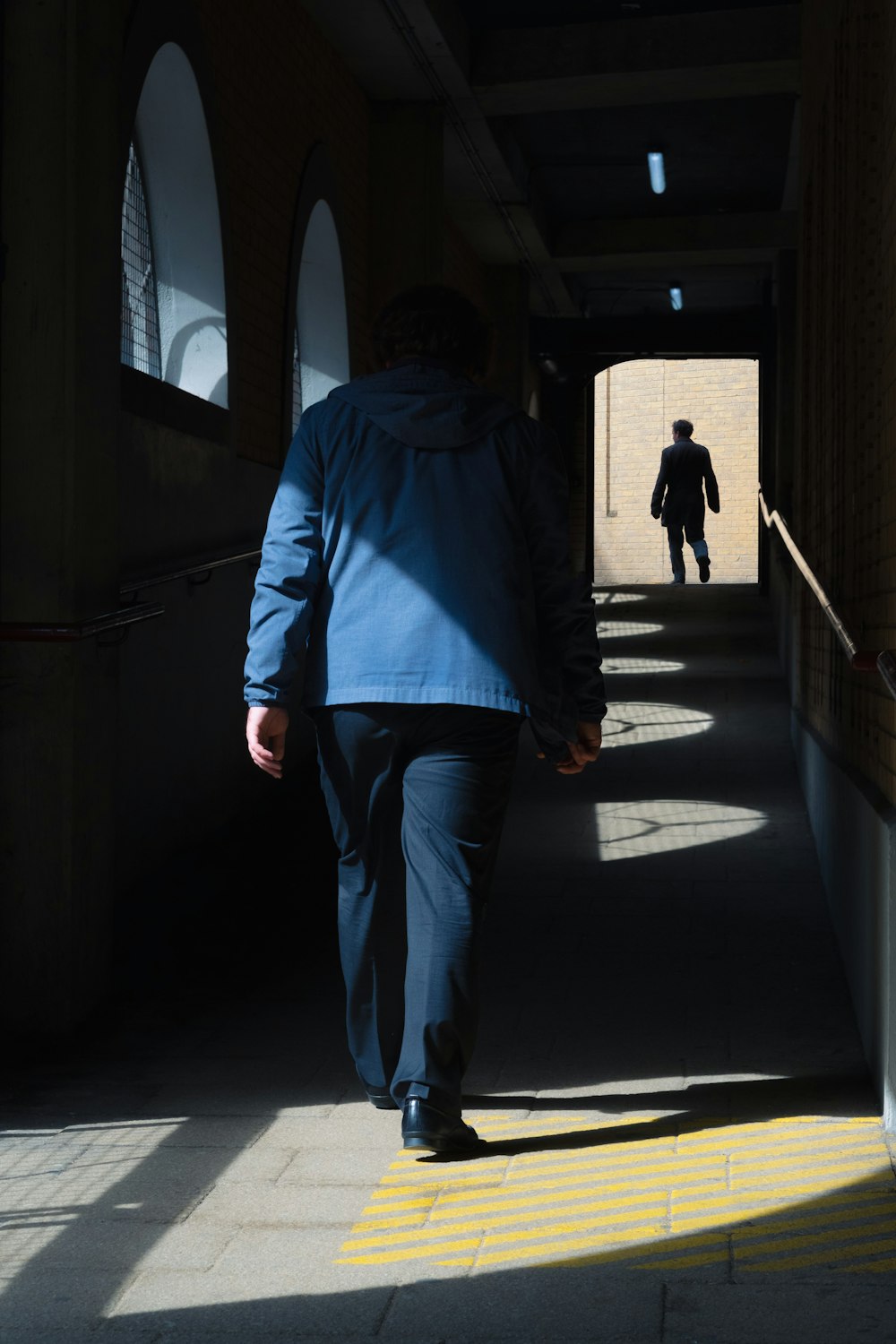 man walking in pathway