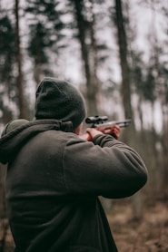 man using sniper rifle