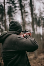 man using sniper rifle